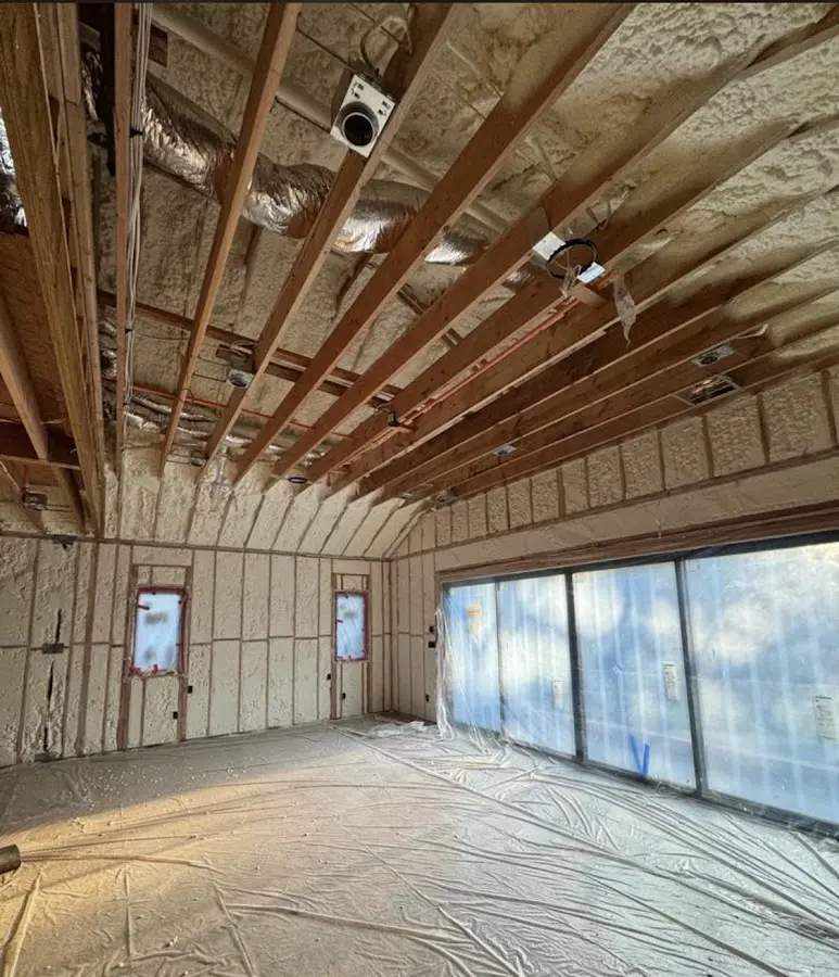 Interior walls and ceiling insulated with spray foam during new construction in Emeryville